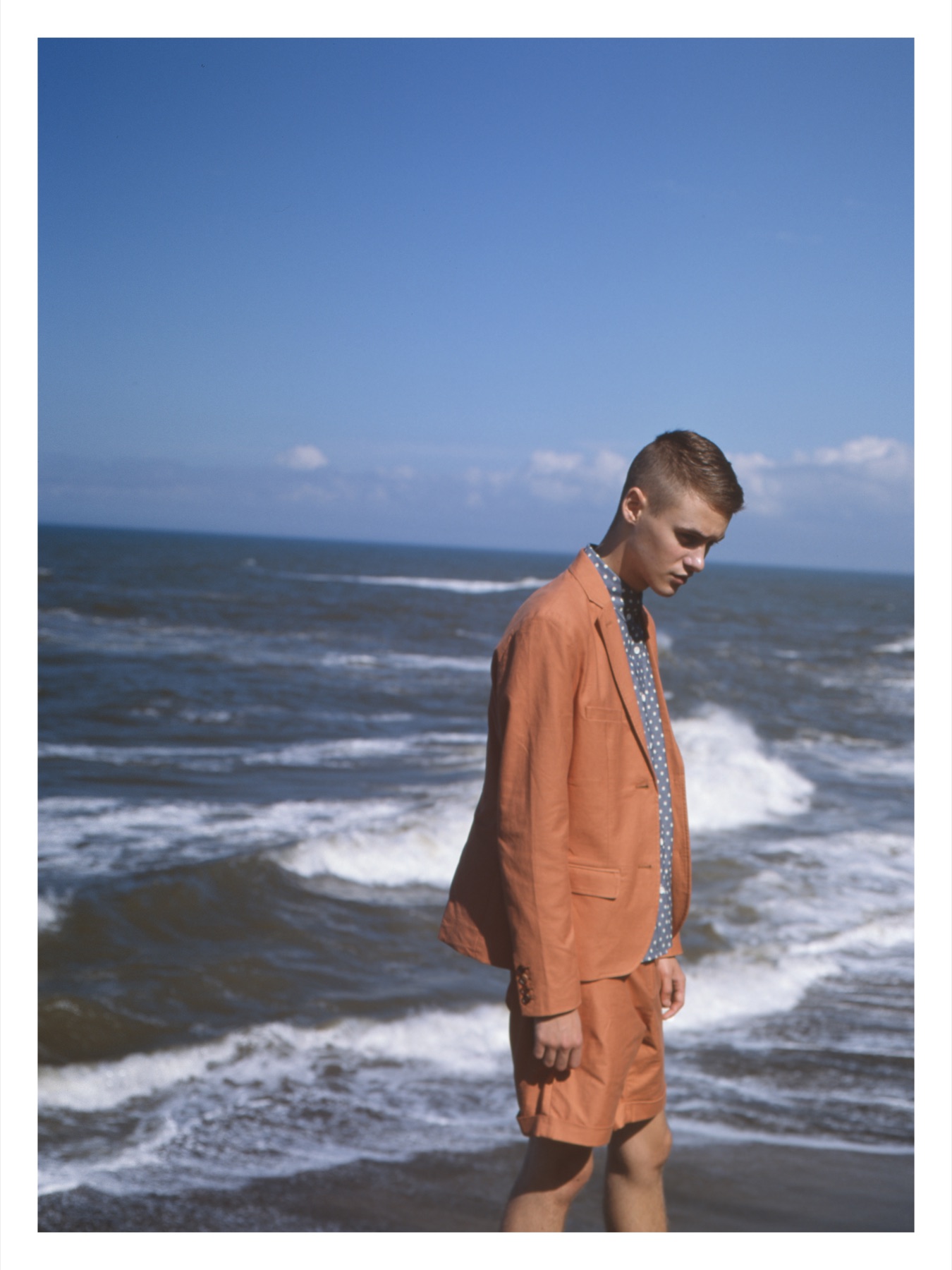 EACH OF ONE orange summer suit beside the sea