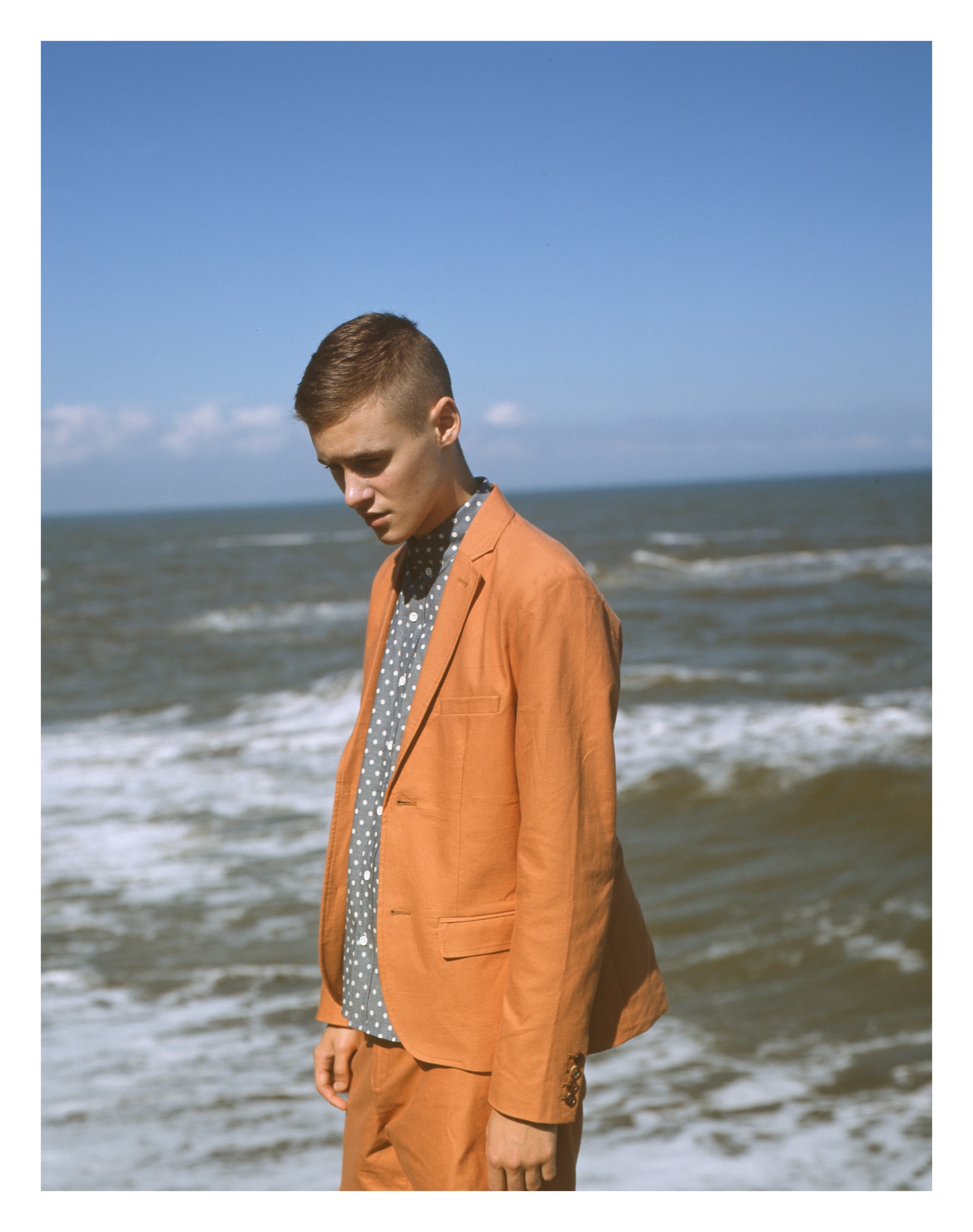 Burnt orange tailoring beside the sea